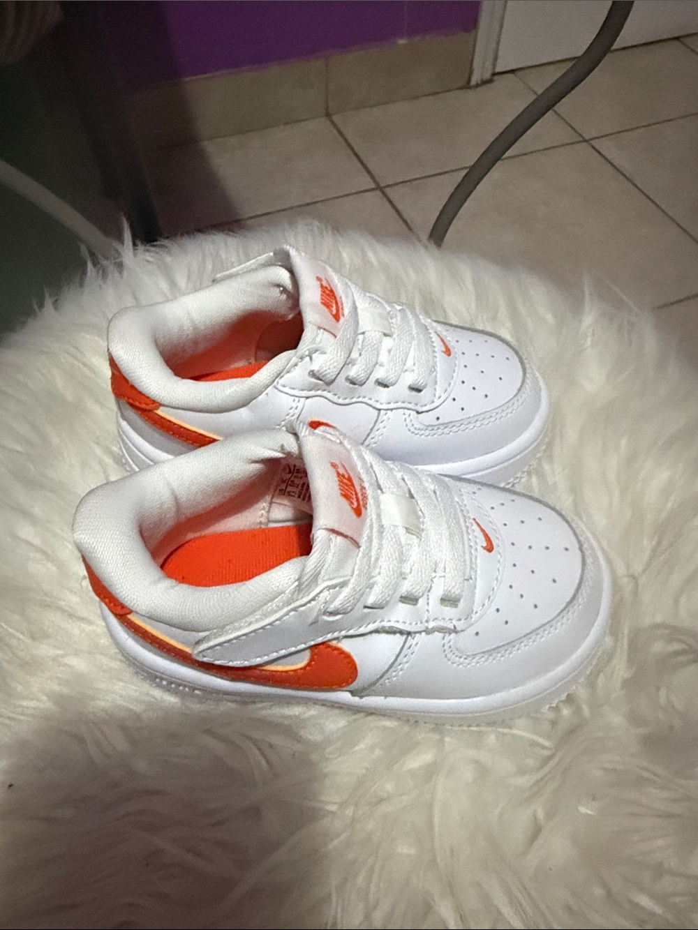 Nike Kids White Sneakers with Orange Swoosh